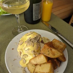 Brisket Benedict with shaved truffle and potatoes.