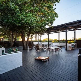 a patio with a table and chairs