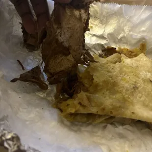 Huge piece of paper in my oxtail roti I order from Culpeppers