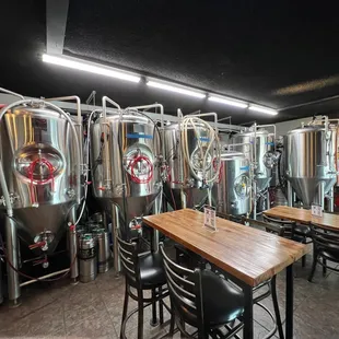 a row of stainless steel tanks