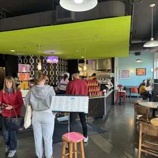 a group of people in a cafe
