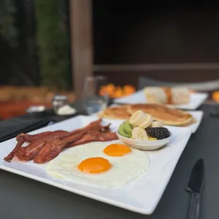 Cakes &amp; eggs with bacon &amp; fruit, breakfast burrito