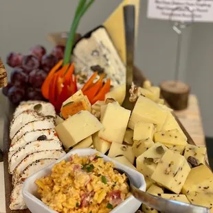 a cheese board with various types of cheese