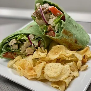 a chicken salad wrap with chips