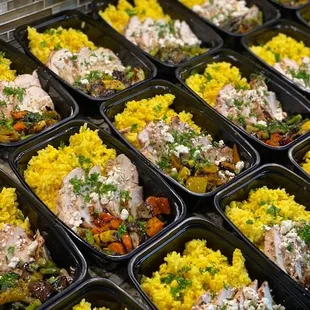 trays of chicken and rice