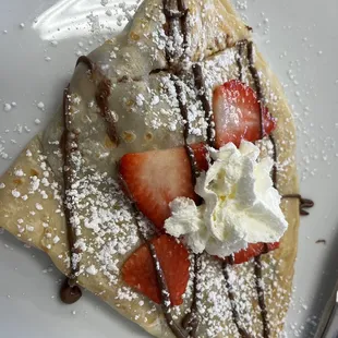 A bit of heaven when eating this strawberry Nutella  crepe