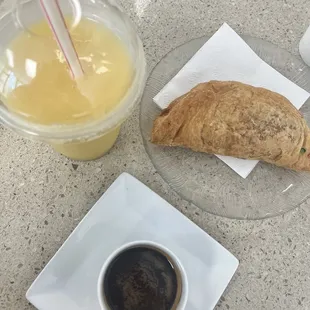 Chorizo + potato empanada, maracuyá smoothie, expresó