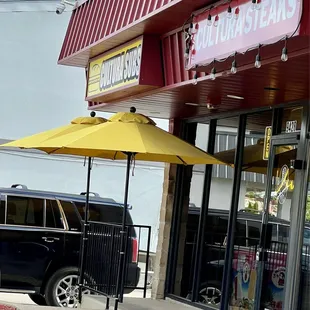 Outside Store Front. See the padlock on the frobt door handle? Do not let that fool you. The door is open.