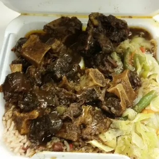 Oxtails cabbage and rice