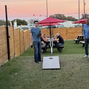 Corn hole game while the sun set