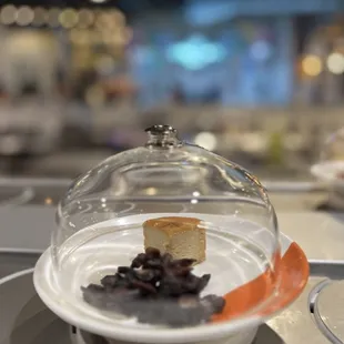 a dessert in a glass dome