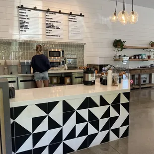 a woman standing at the counter