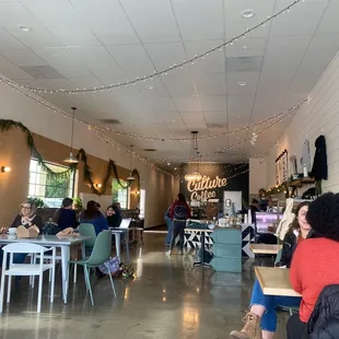 people sitting at tables with laptops