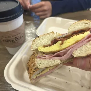 Breakfast sandwich (everything bagel w/ ham, bacon) and almond milk latte