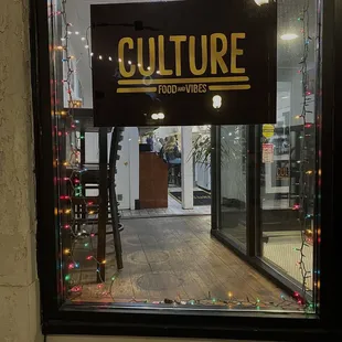 a storefront with a sign in the window