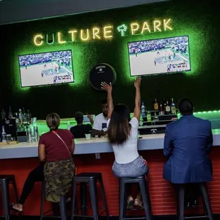 people sitting at a bar