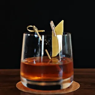 Sazerac Rye whisky, turbinado sugar, Peychaud's Bitters, Absinthe, lemon peel