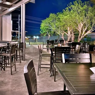 tables and chairs outside at night