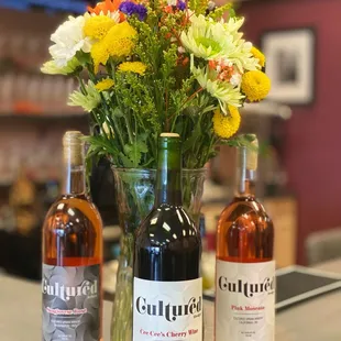 bottles of wine and flowers