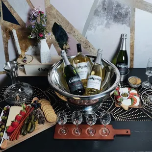 a table with wine and snacks