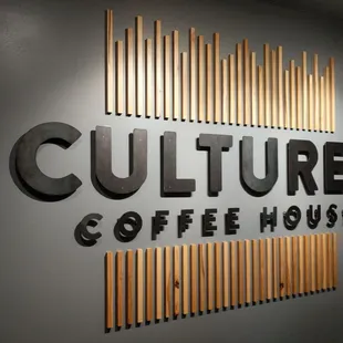 a wall with a sign that says culture&apos;s coffee house