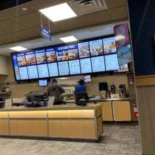 a restaurant counter and menus