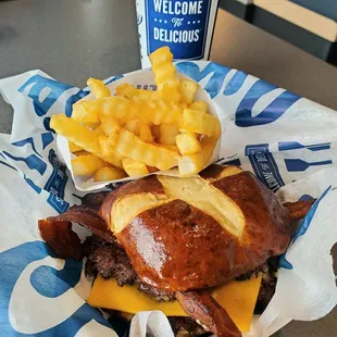 A delicious Pretzel Haus Pub Burger with crispy thick cut bacon