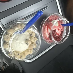 Vanilla icecream, one with raspberries, the other with cookie dough.