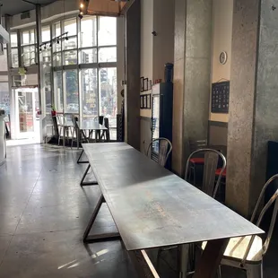 a long table and chairs in a restaurant