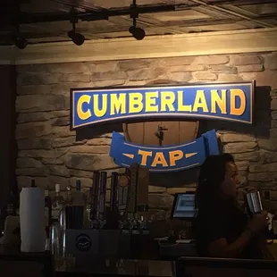 a woman behind the bar