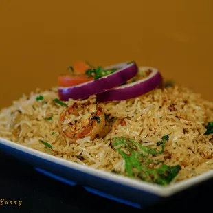 a plate of rice and vegetables