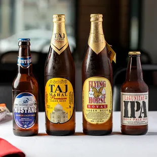a variety of beer bottles on a table