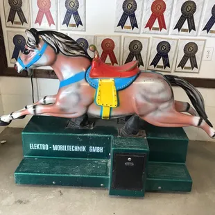 a horse on display in a room