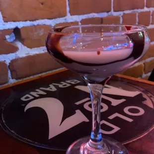 a cocktail in a coupe glass