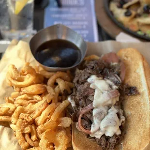 Load it up! With onion rings.. a must! The bread, the meat, plus sauce u don't need anything more