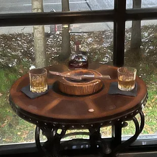 two glasses of whiskey on a table