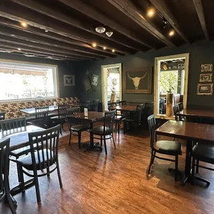 a dining area with tables and chairs