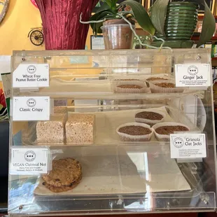 a display of cupcakes and pastries