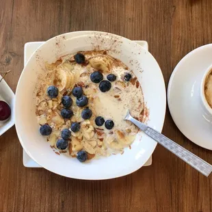 Granola with berries, and latte.