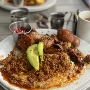 Huevos Rancheros with OM eggs a side of chorizo and added some avocado .. Talk about AMAZING
