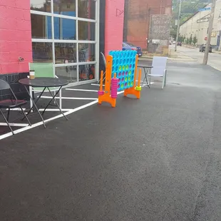 Outside seating with newly paved parking lot.