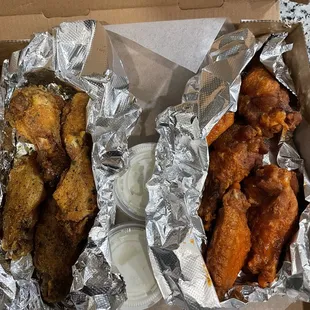 a box of chicken wings and dipping sauce