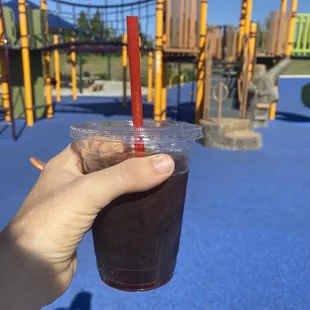 Iced espresso and a local playground