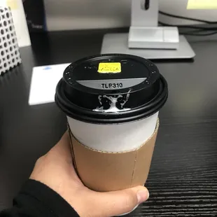 Cute little sticker on my coffee