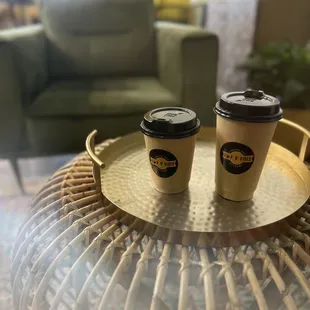  two coffee cups on a tray