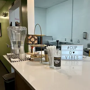  a counter top with a cup of coffee