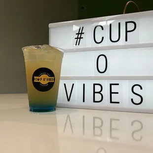  a drink in a plastic cup