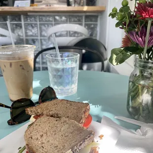 Spinach, tomato, and Swiss sandwich.