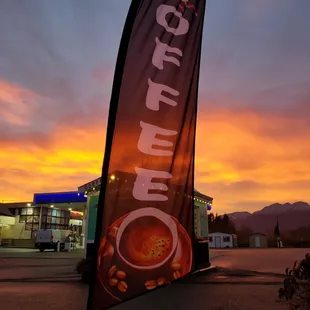 a cup of coffee and a sunset