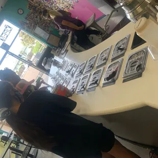 a woman sitting at a table in a coffee shop